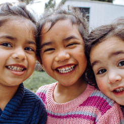 three girls smiling